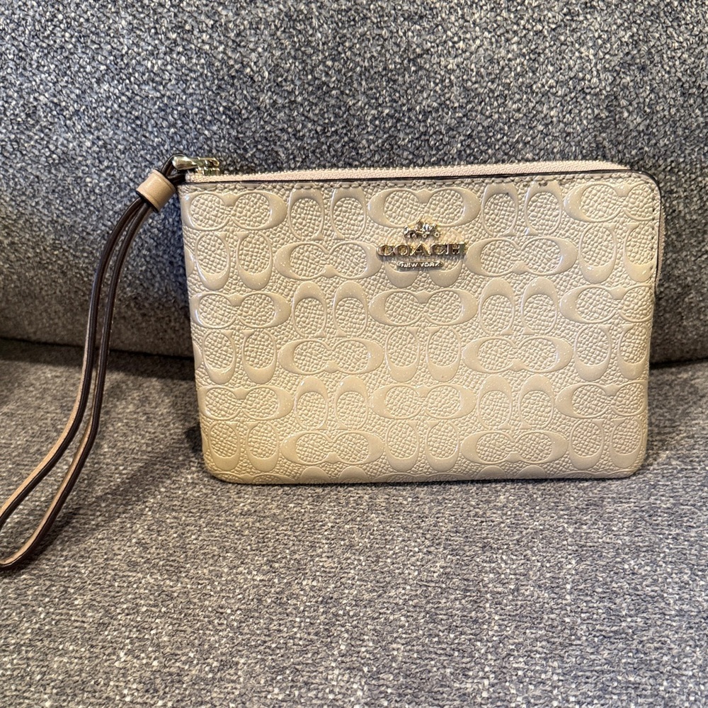 Coach Embossed Floral Wristlet in Cream
